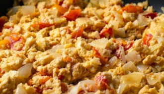 Garlic scrambled eggs with onions and tomatoes